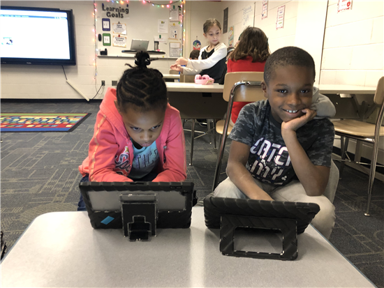 students work together to learn coding,